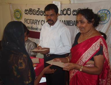Photo: Prem presenting relief aid